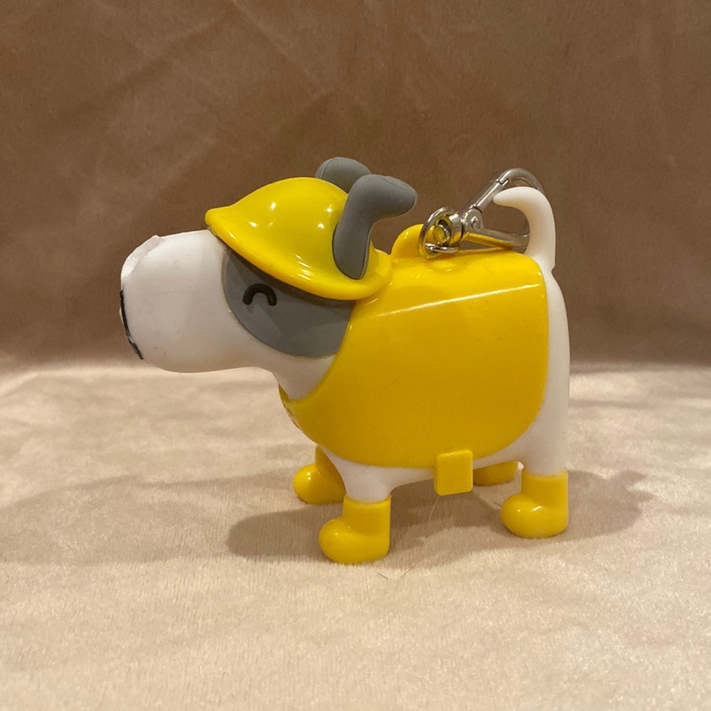 Dog in raincoat hand sanitizer holder